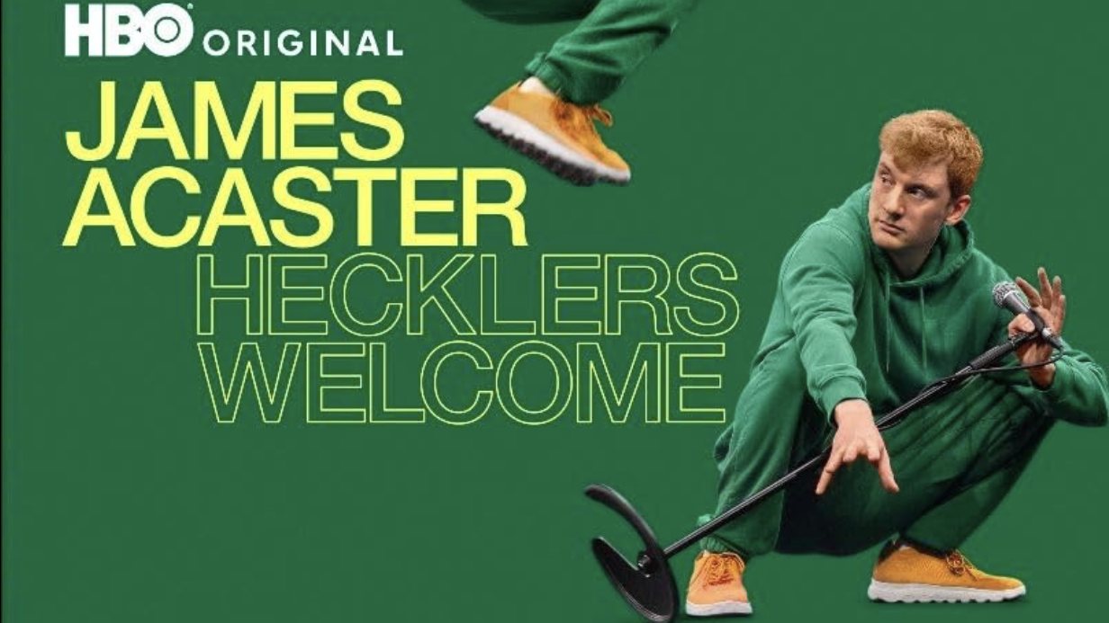James Acaster crouching with a mic stand beside the Hecklers Welcome title, from the HBO artwork
